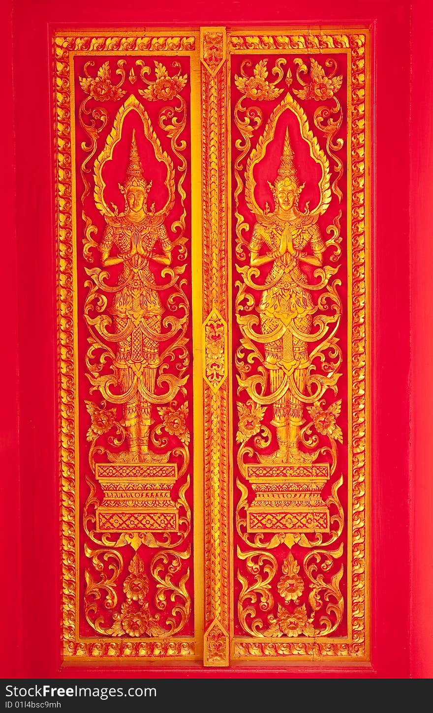 Traditional Thai art church door of Wat Klang Wiang, Chiang Rai province, Thailand