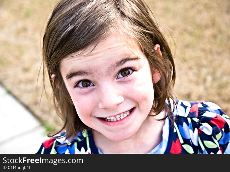 Close up of a cute girl with an adorable expression of pleasure. 6 years old. Close up of a cute girl with an adorable expression of pleasure. 6 years old