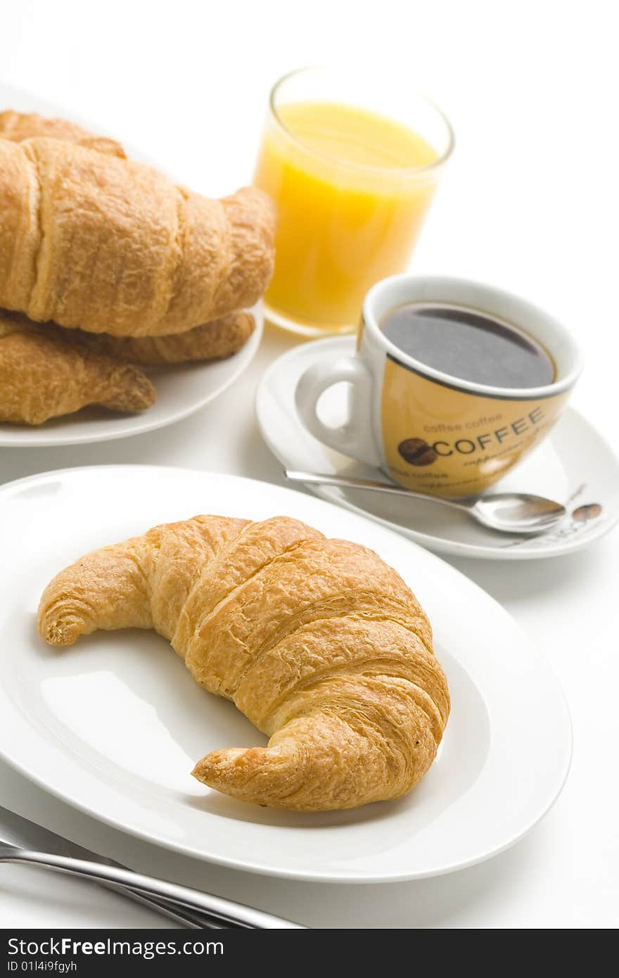 Continental Breakfast Of Coffee And Croissants