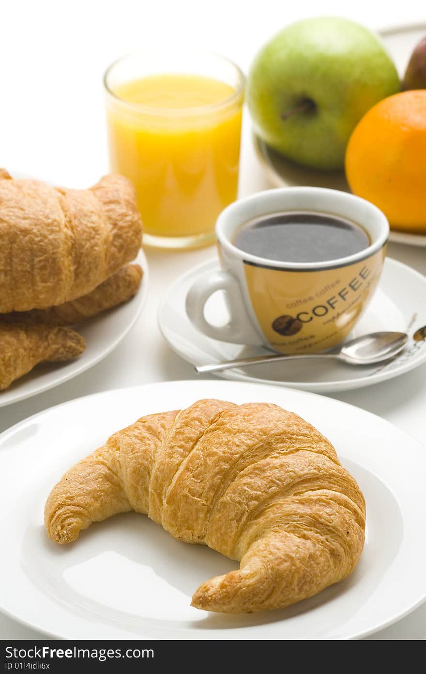 Continental breakfast of coffee and croissants