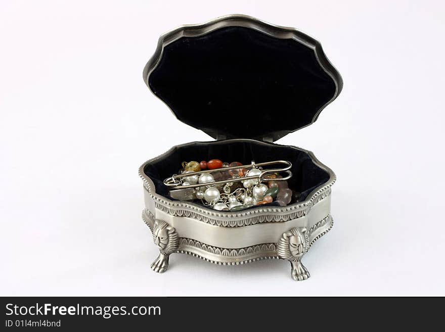 A tin jewelry box on the white background.