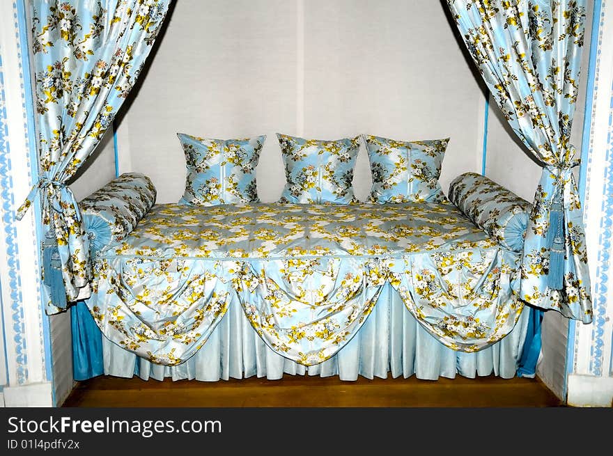 The old-fashioned bed in mansion. The old-fashioned bed in mansion