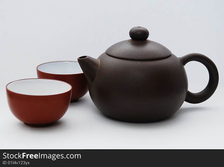 Chinese ceramic teapot with ornament on white background