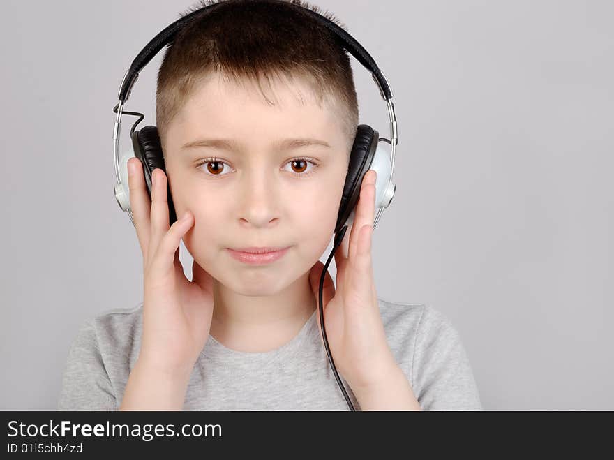 Boy in headphones with copy space. Boy in headphones with copy space