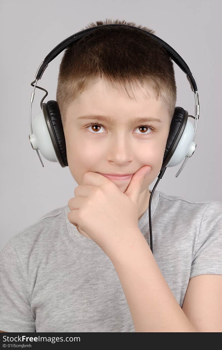 Portrait of listening boy in headphones