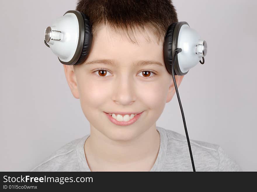 Portrait of listening boy in headphones. Portrait of listening boy in headphones