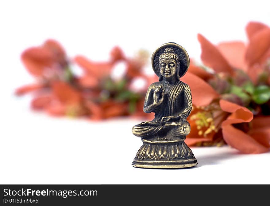 Isolated Buddha With Red Flowers