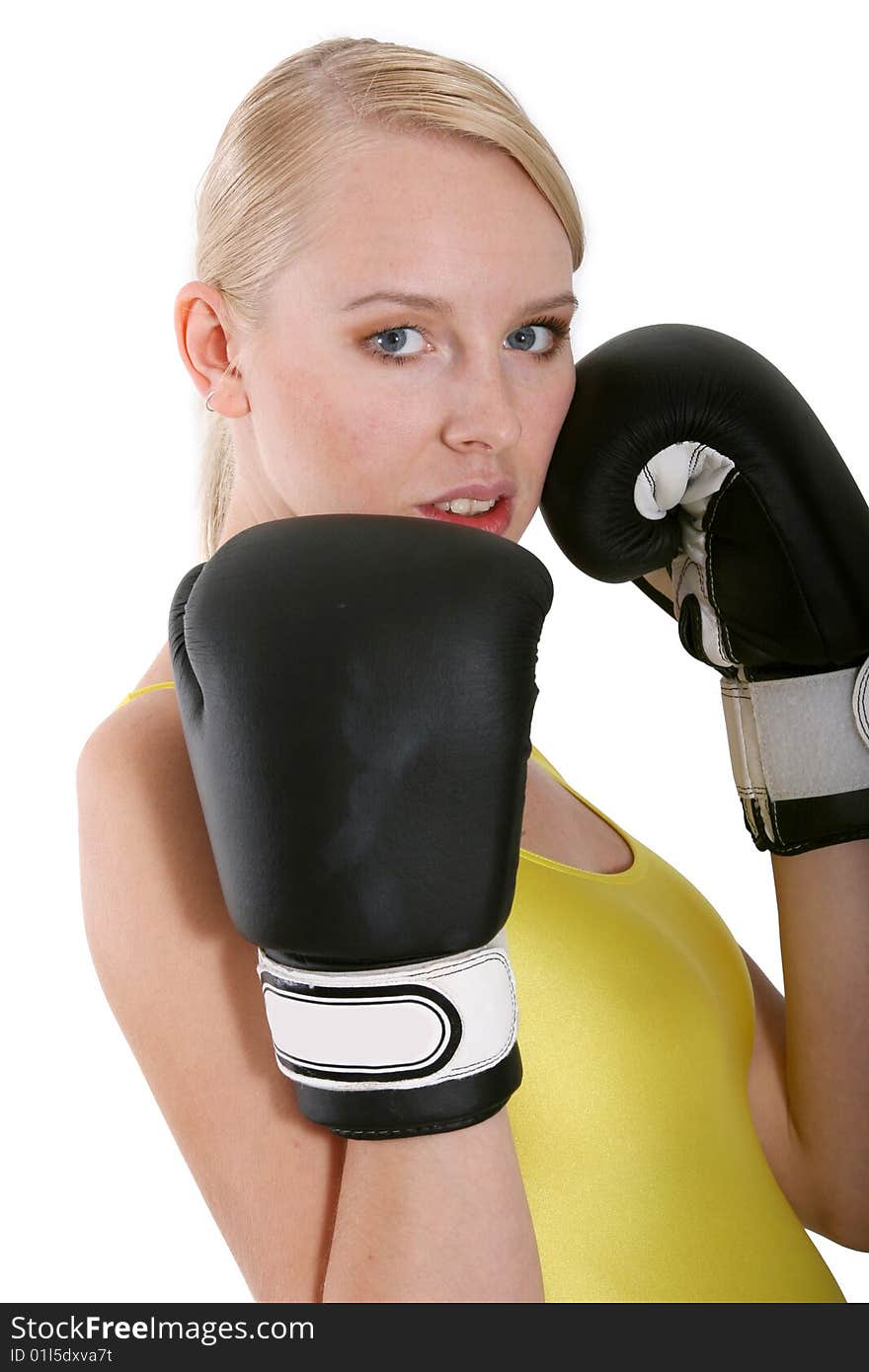 Woman in boxing gloves in studio over white