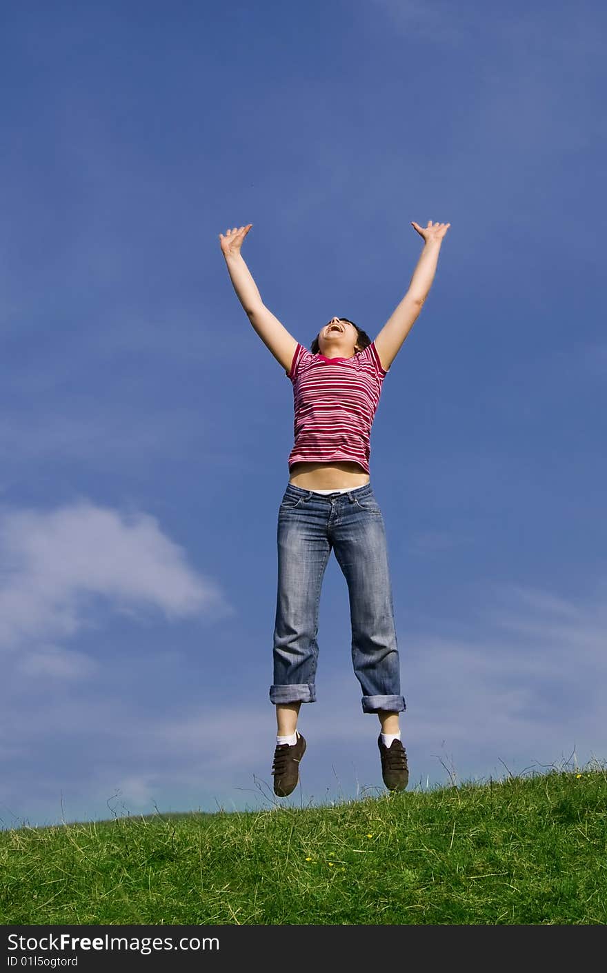 Young happy woman jumping high