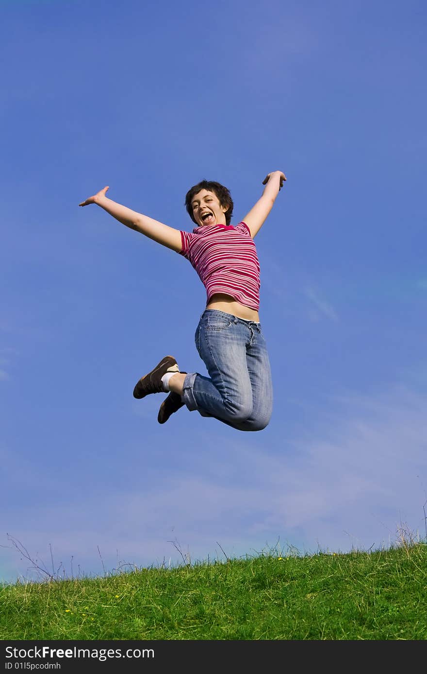 Young happy woman jumping high