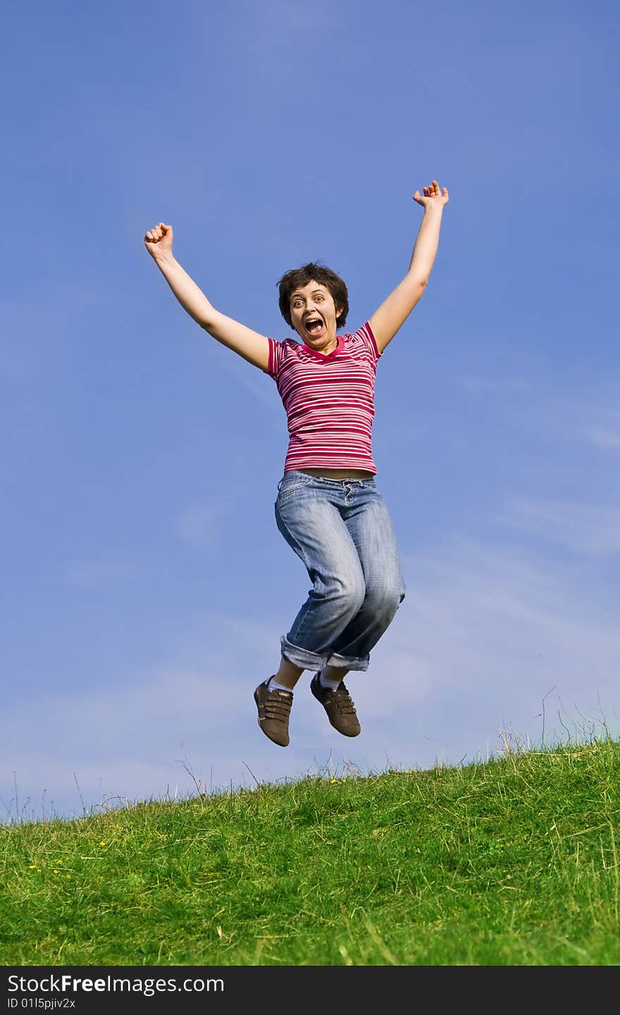 Young happy woman jumping high