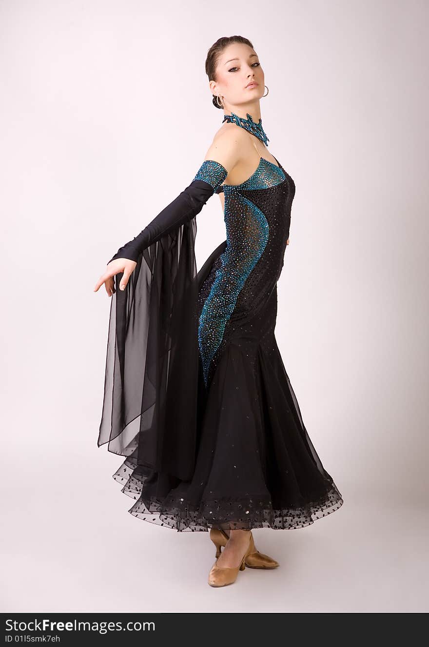 Professional dancer girl in beautiful dress, studio shot