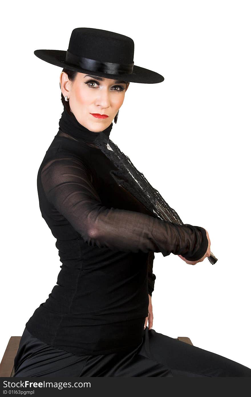 Spanish Dancer in a black costume with hat and accessories