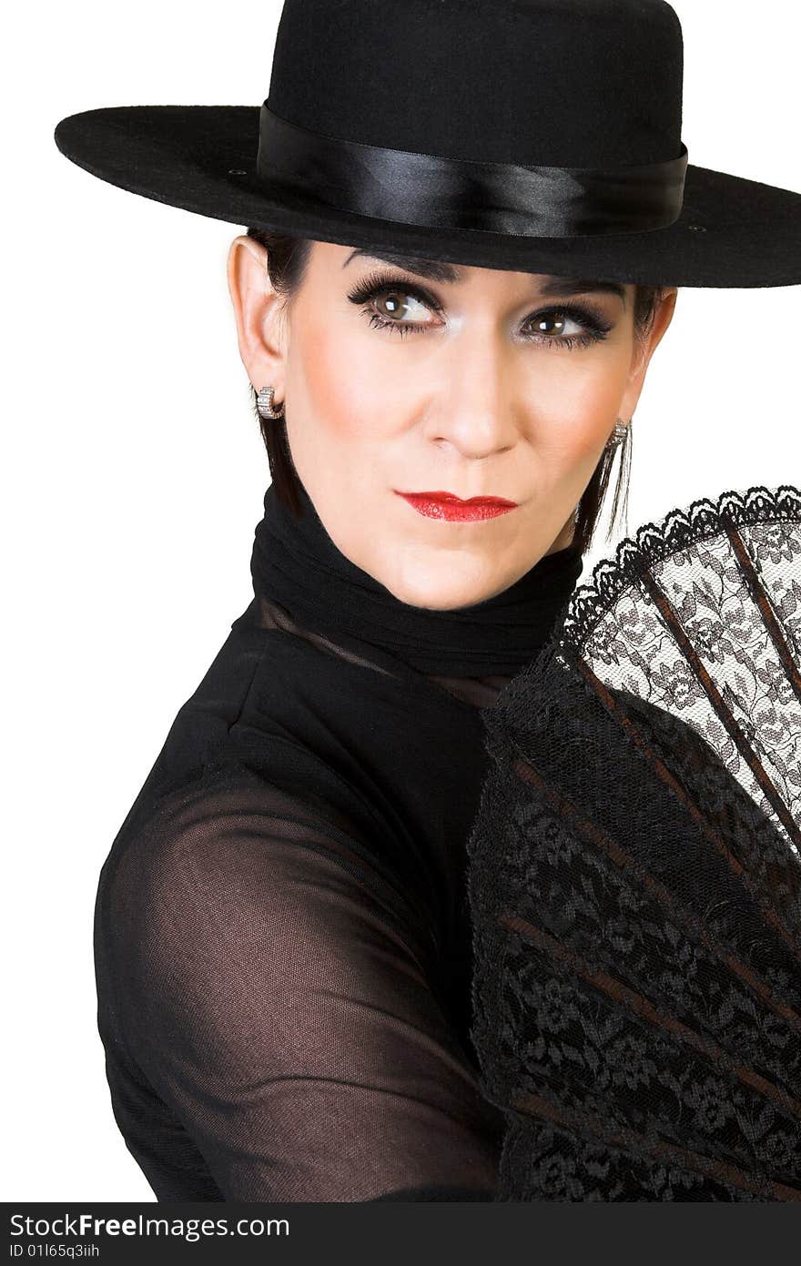 Spanish Dancer in a black costume with hat and accessories