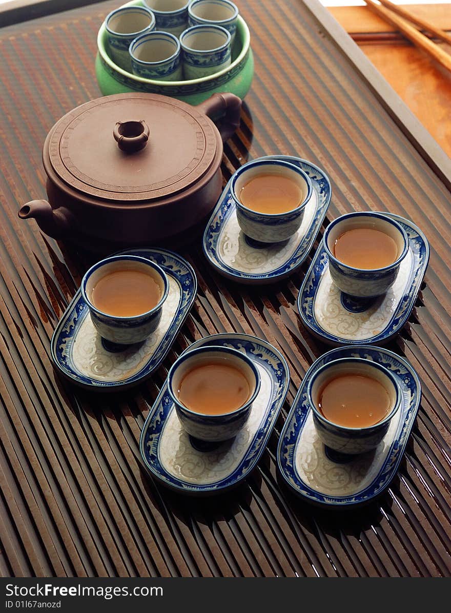 Chinese kung fu tea set
five cups of tea and a ceramic pot