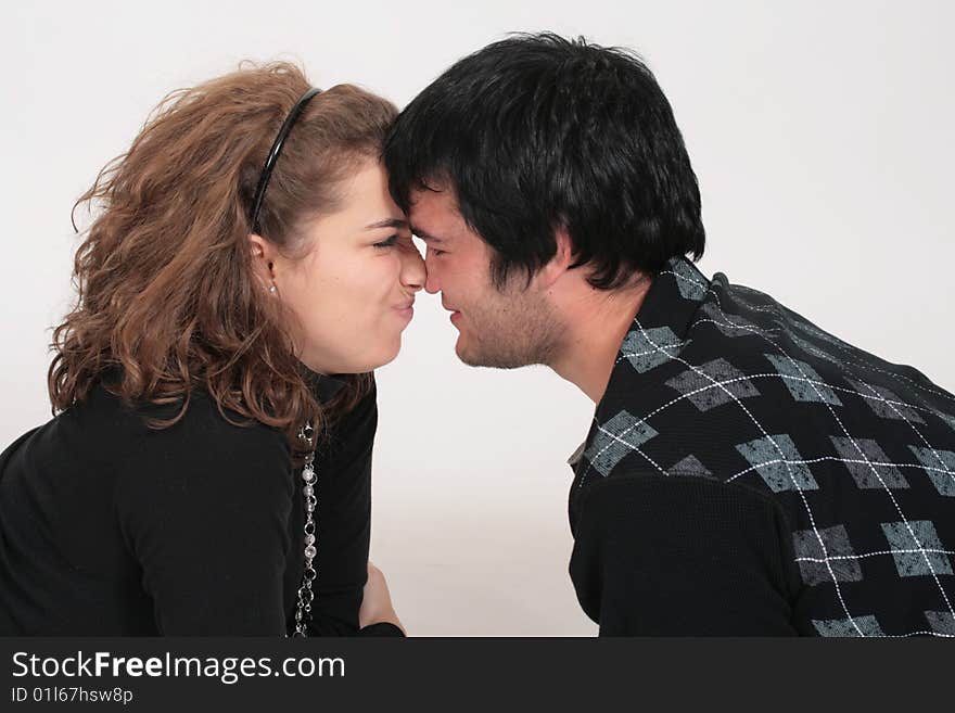 A couple playing during a photo shoot. A couple playing during a photo shoot.