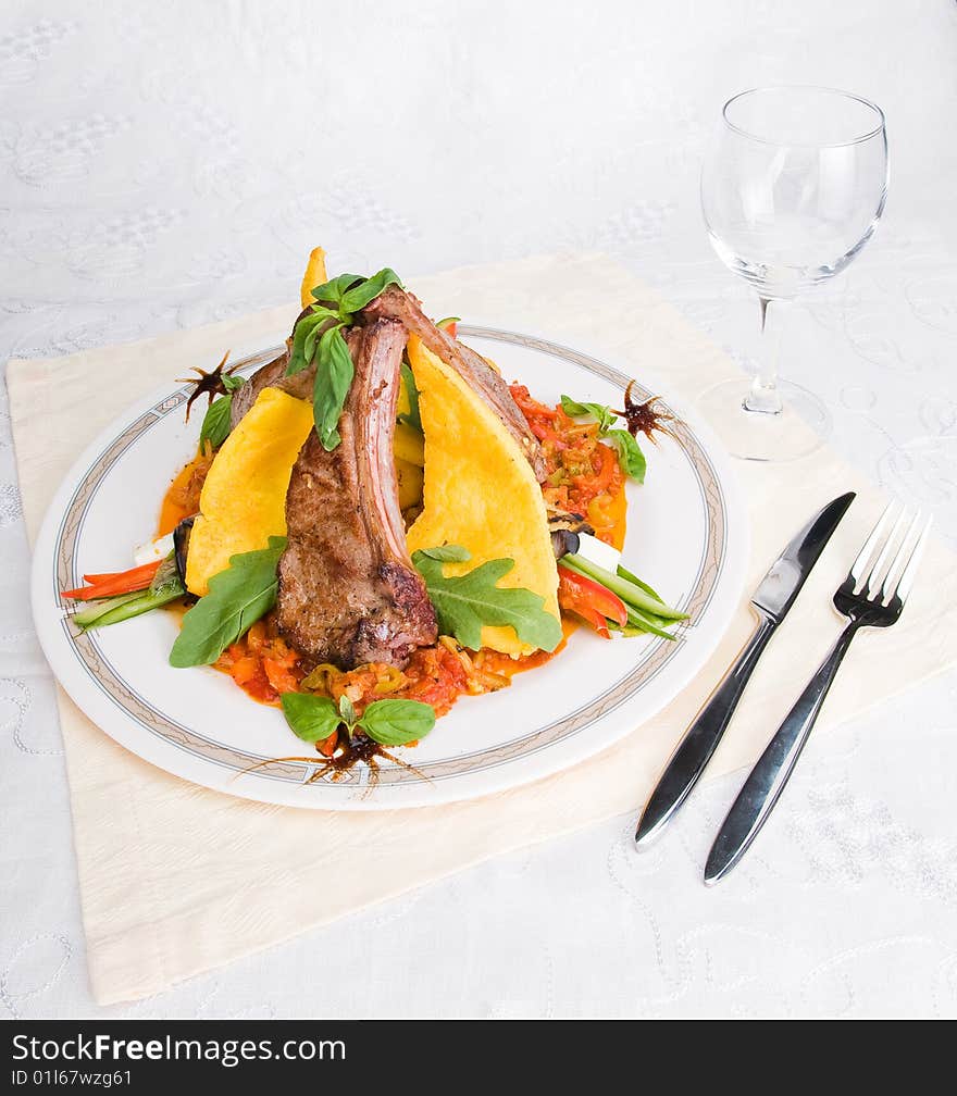 Meat and vegetables over light background