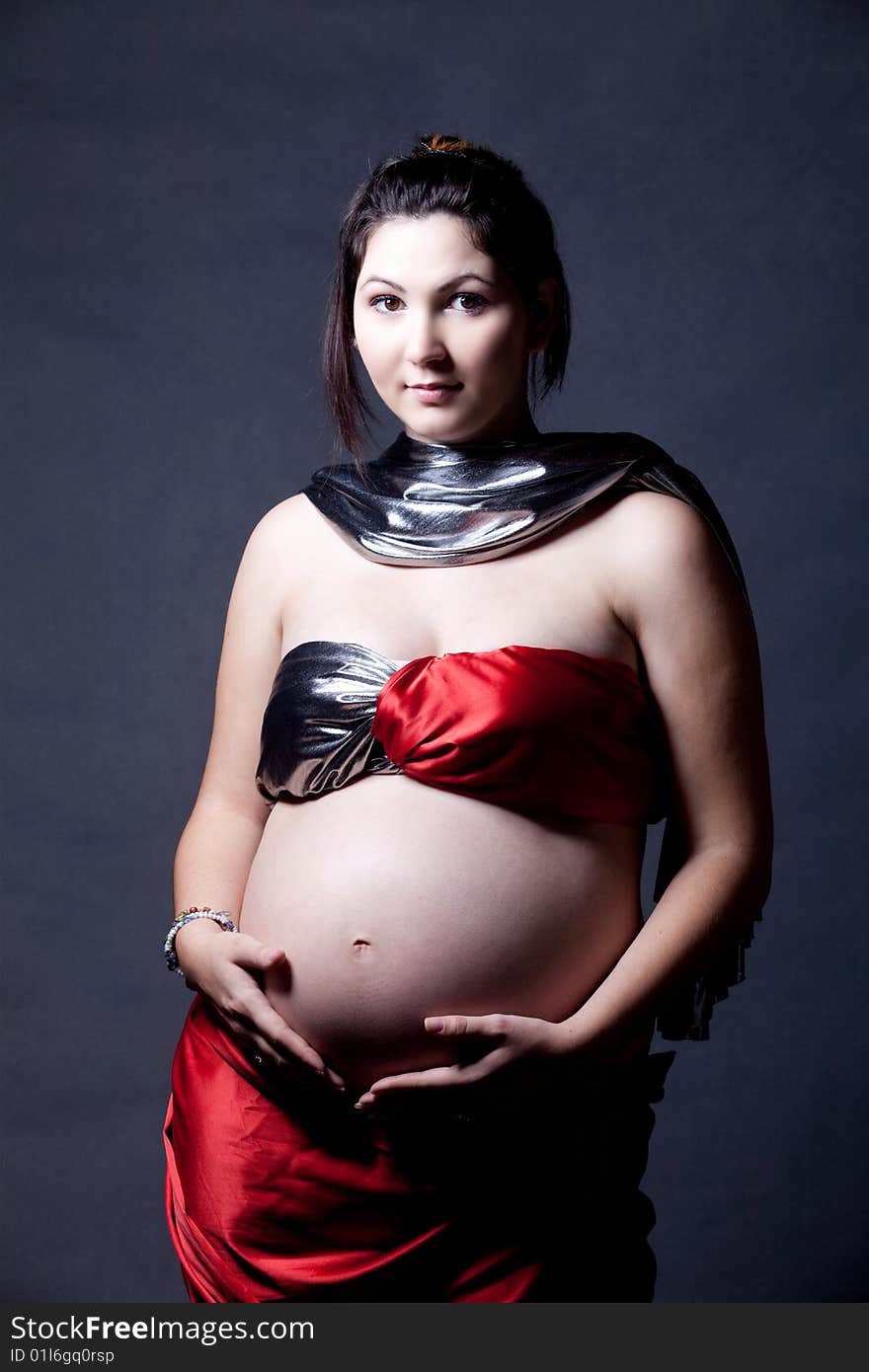 The pregnant woman showing her womb