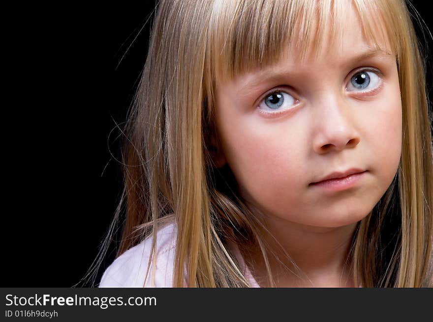 Blond Girl with big blue eyes on a black background