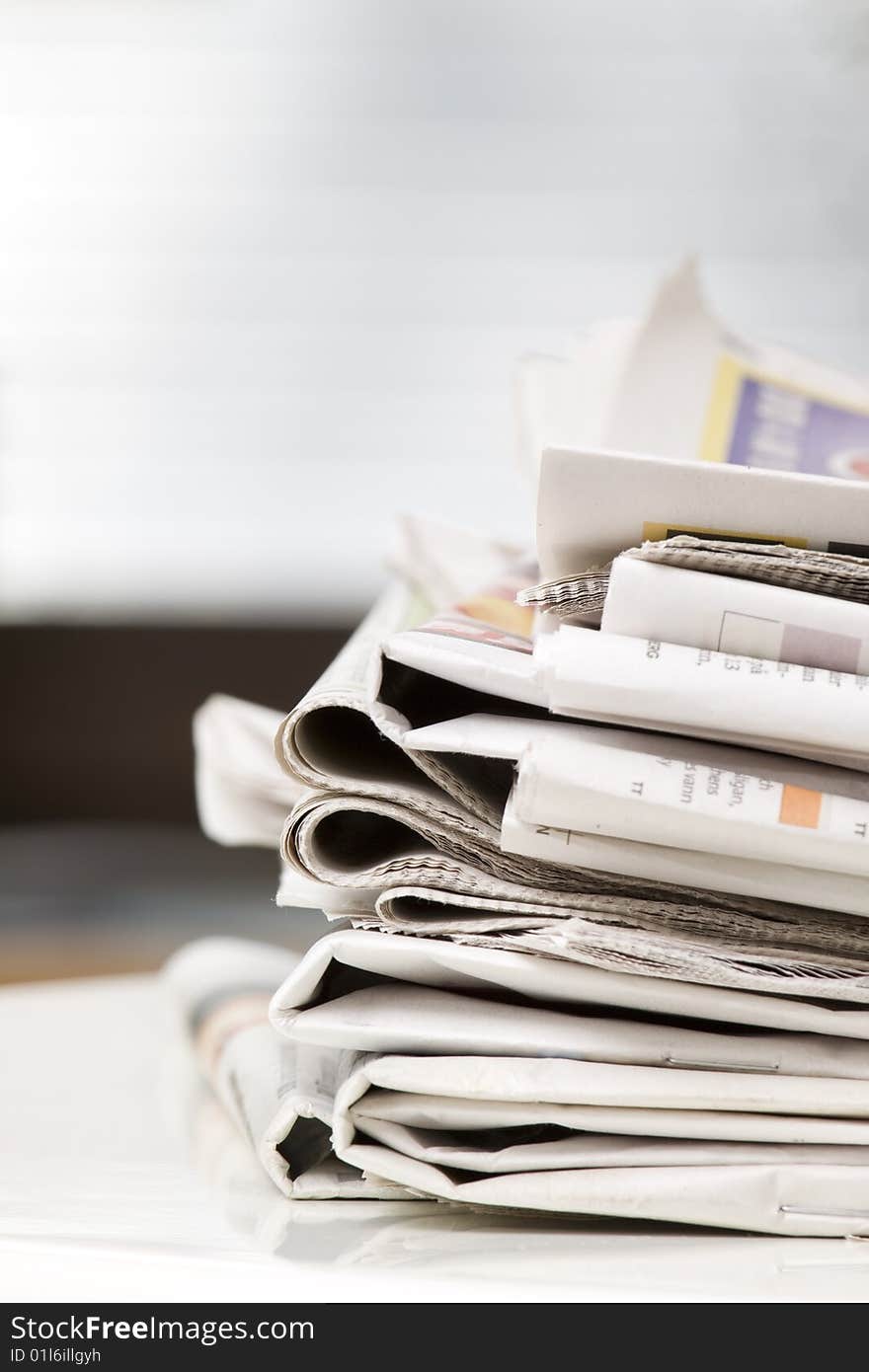 Pile of newspapers on the table