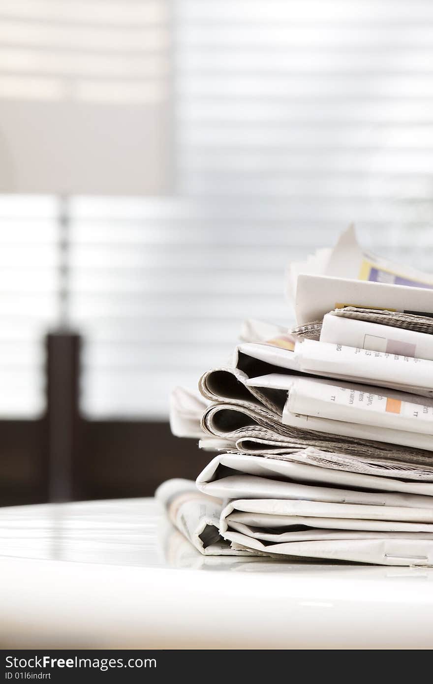 Pile of newspapers on the table