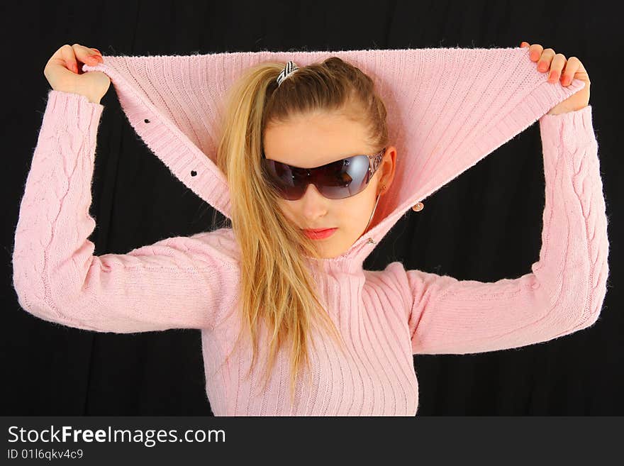 The portrait of the girl on black background