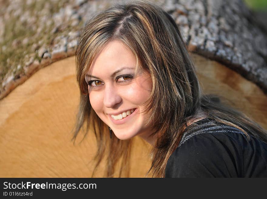 Outdoor portrait of a brunette woman with big brown eyes. Outdoor portrait of a brunette woman with big brown eyes