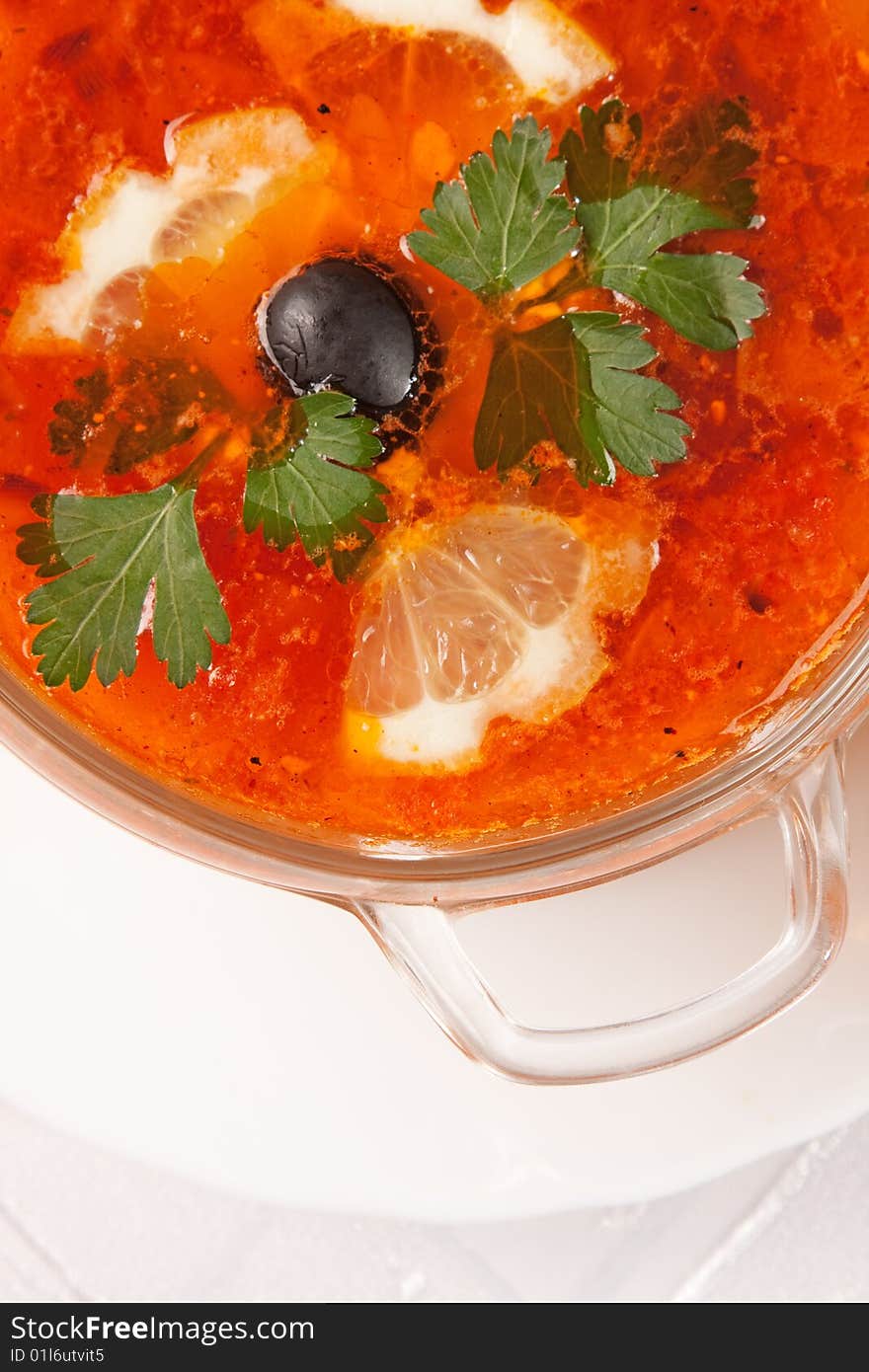 Delicious red soup close up over white