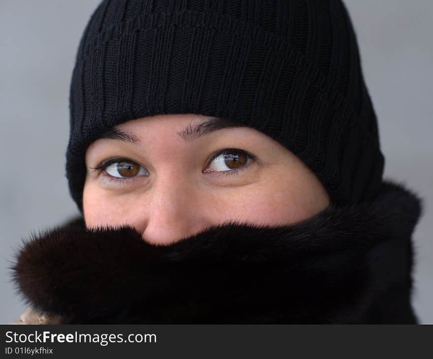 Pretty lady close-up face portrait on gray background