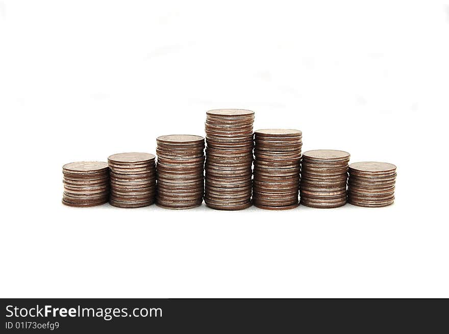 Pyramid combined from coins on a white background