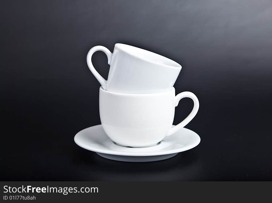 Two cups of white on  black