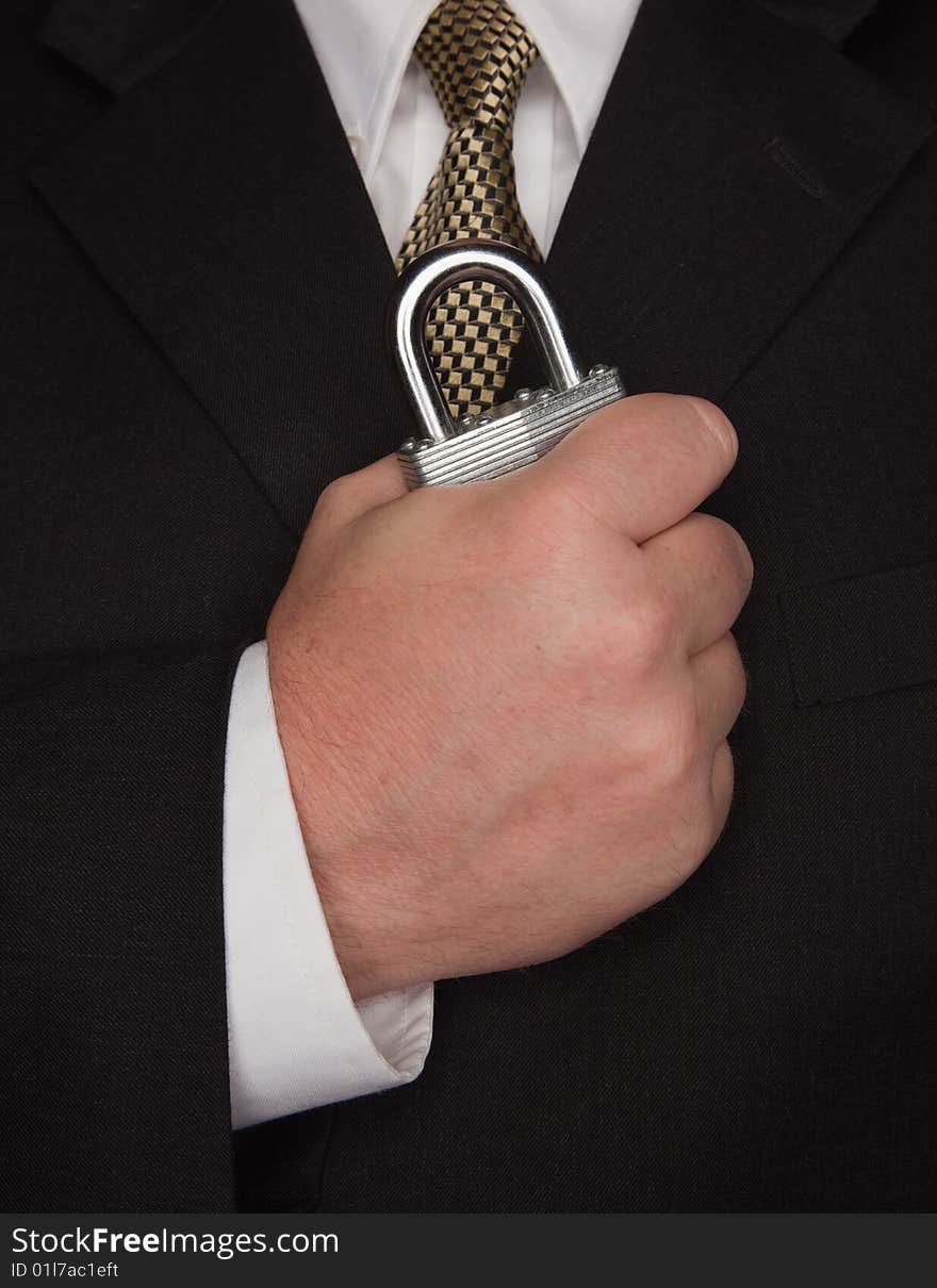 Businessman Holding Large Lock