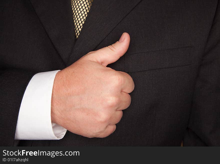 Businessman with Coat and Tie Gesturing Thumbs Up with Hand. Businessman with Coat and Tie Gesturing Thumbs Up with Hand.