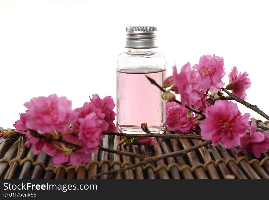 Bowl of sakura blossoms on bamboo mat. Bowl of sakura blossoms on bamboo mat