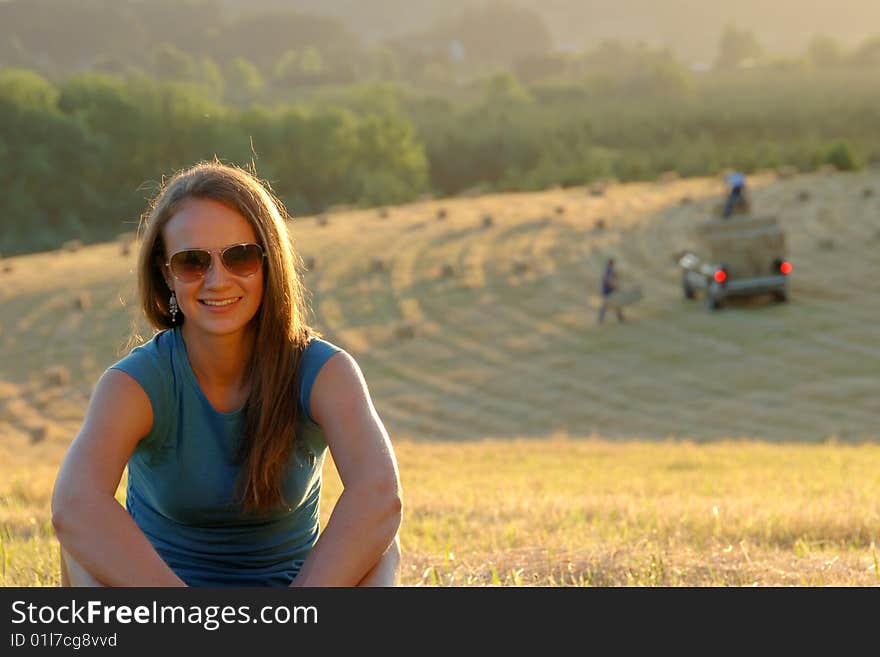 Teenage girl sitting outdoors