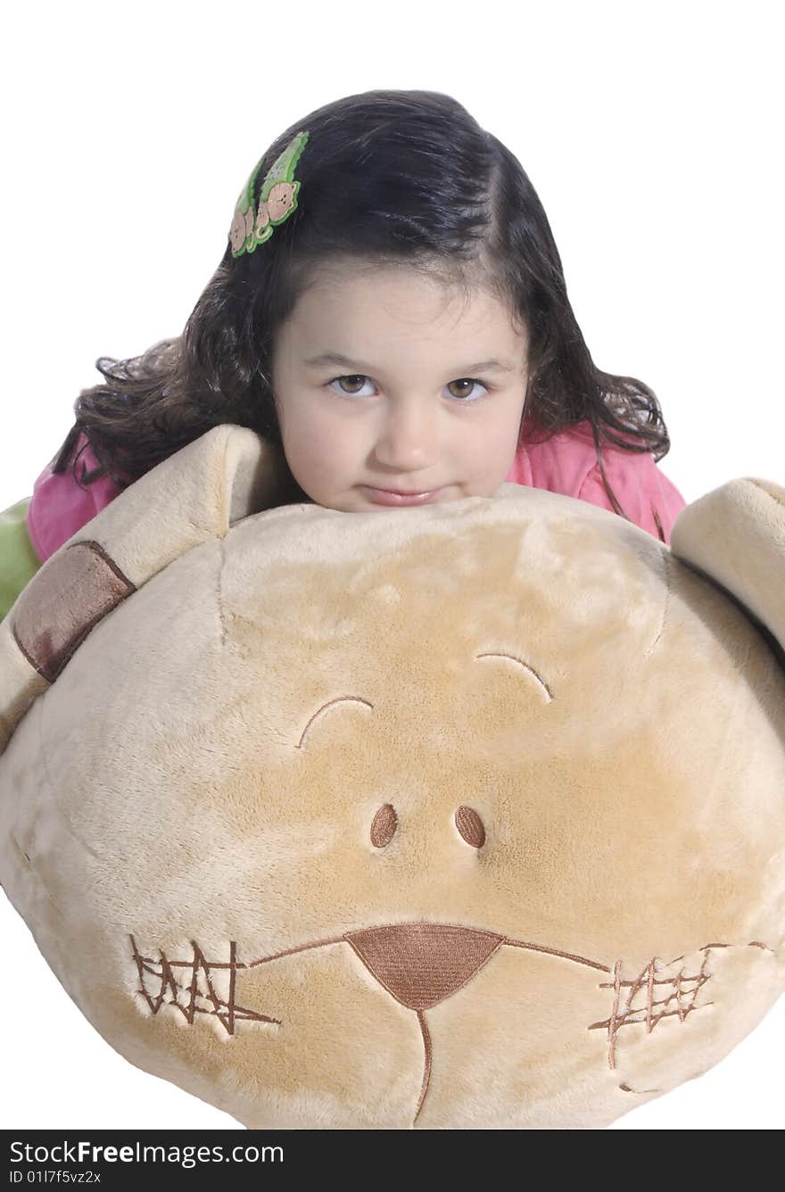 A little girl hugging a big teddy bear isolated on white background. A little girl hugging a big teddy bear isolated on white background