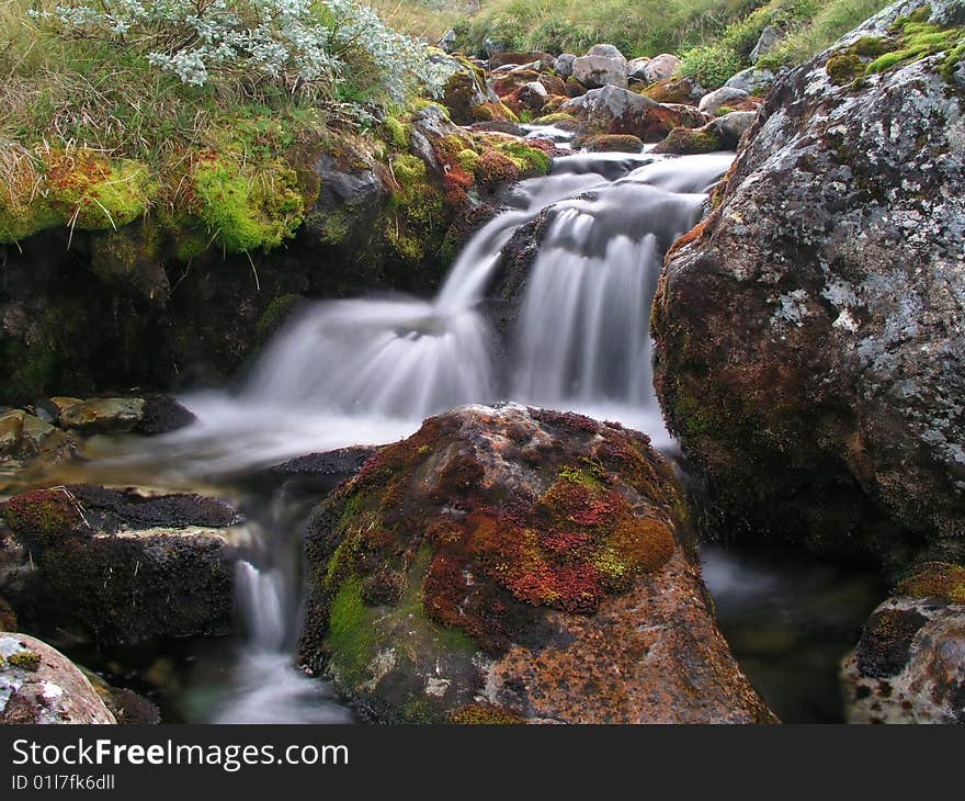 A beautiful mountain stream in autumn. A beautiful mountain stream in autumn.