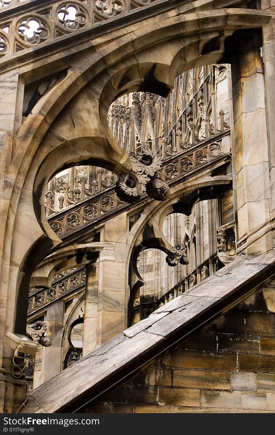 Detail of filagree stone carving on the flying butresses of the Milan Cathedral in Italy. Detail of filagree stone carving on the flying butresses of the Milan Cathedral in Italy