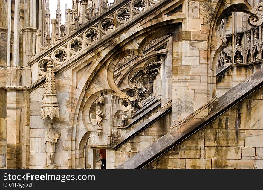 Detail of filagree stone carving on the flying butresses of the Milan Cathedral in Italy. Detail of filagree stone carving on the flying butresses of the Milan Cathedral in Italy