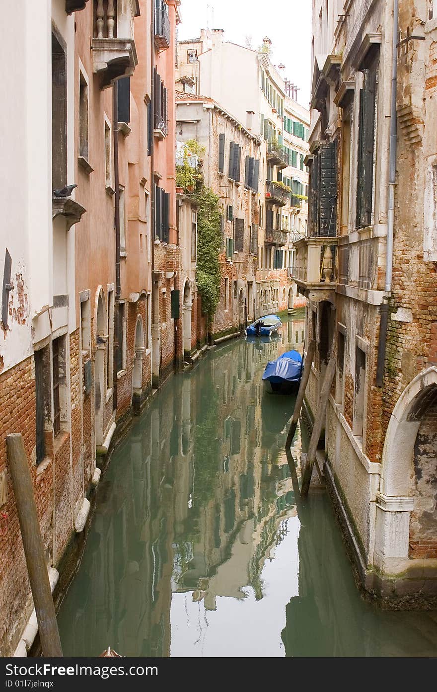 Canal in ancient Venice Italy with boats. Canal in ancient Venice Italy with boats