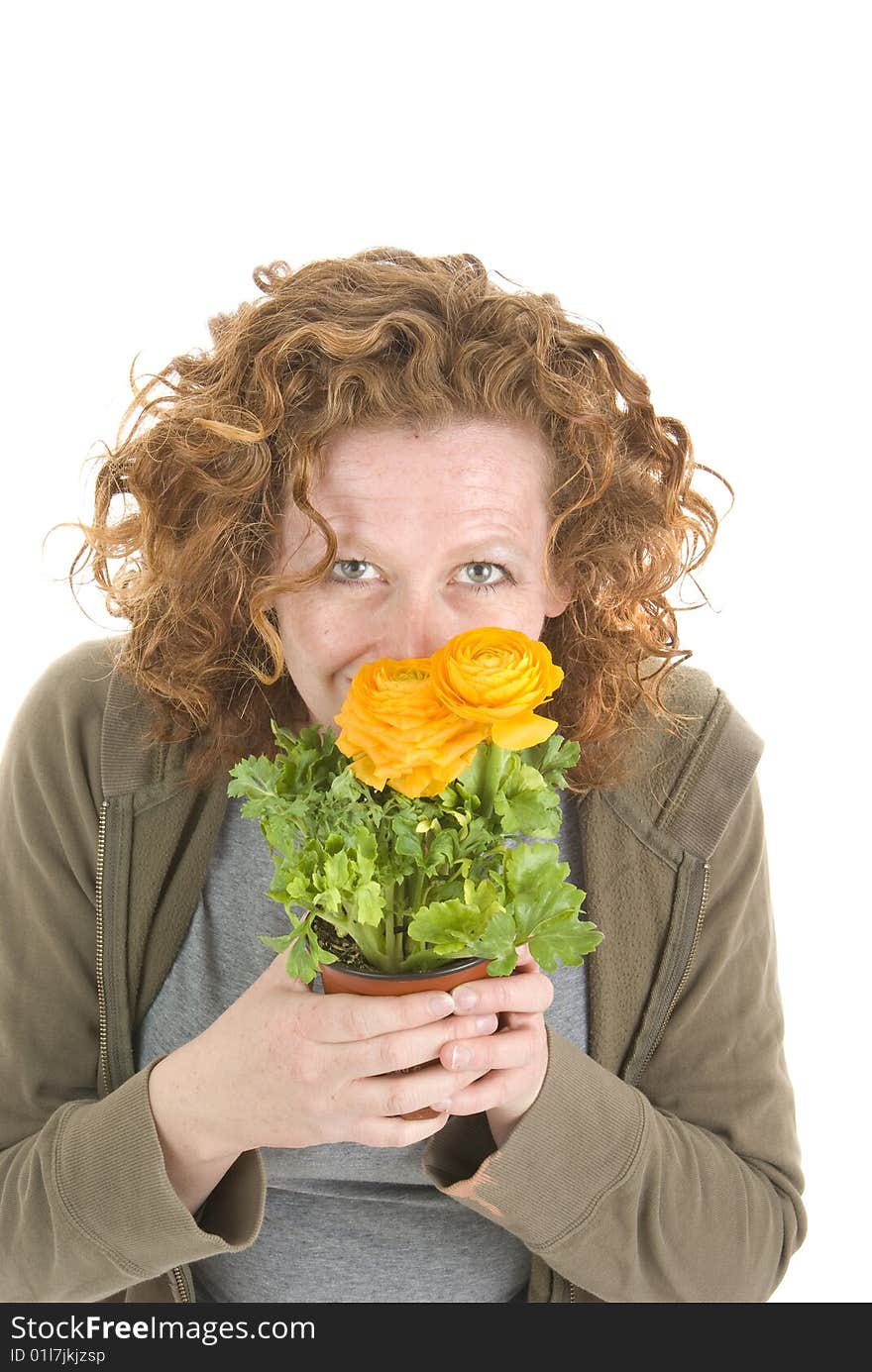 Woman  smells yellow plant