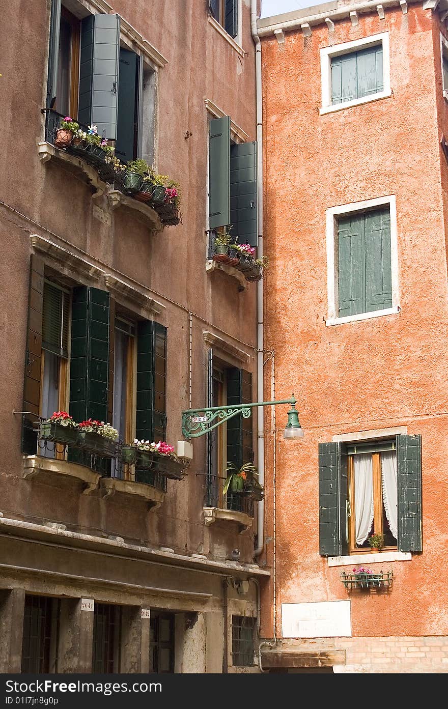 Building fronts in Venice Italy with flowers and colorful exteriors. Building fronts in Venice Italy with flowers and colorful exteriors