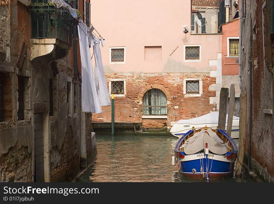 Canal in ancient Venice Italy with boats. Canal in ancient Venice Italy with boats