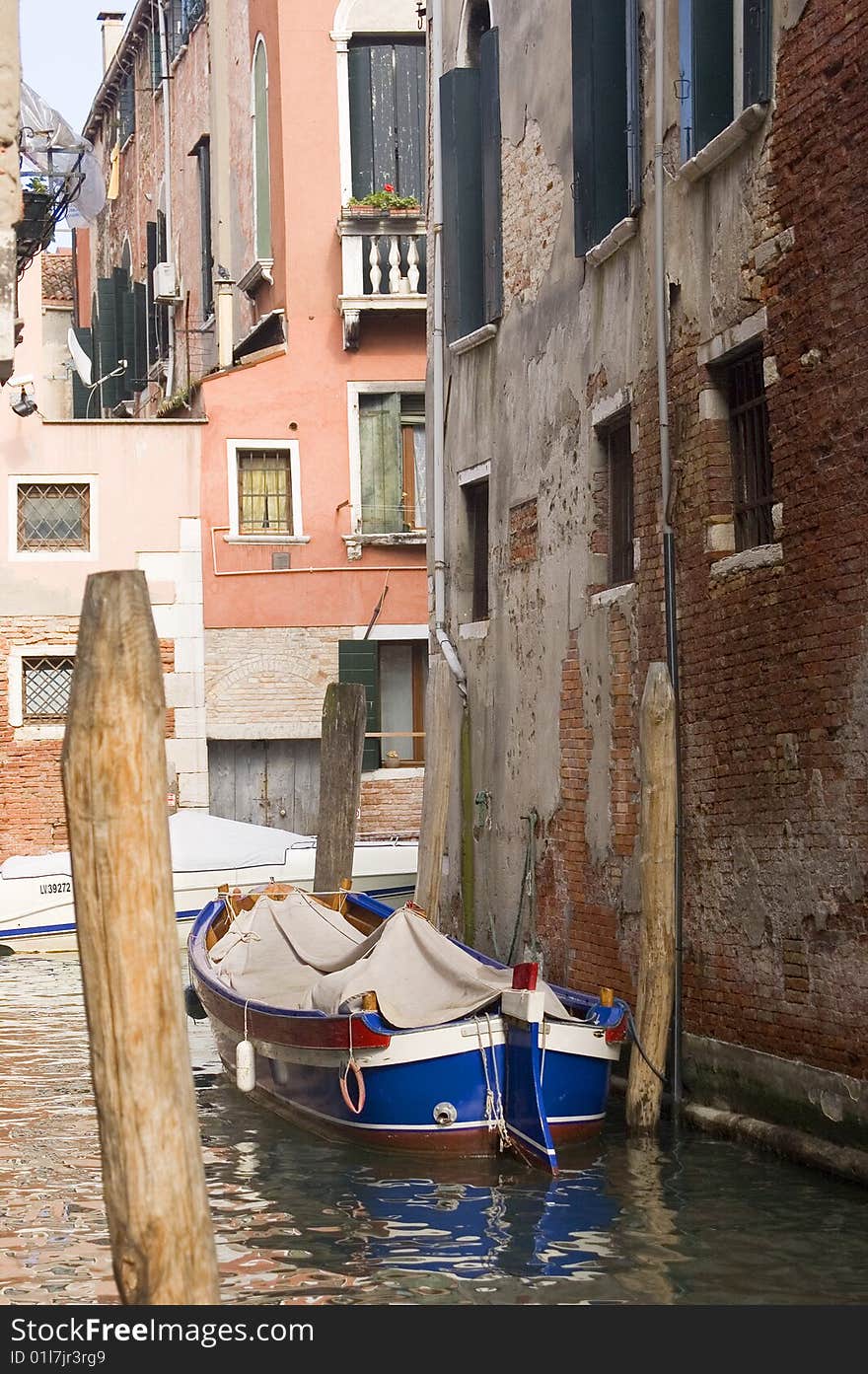 Canal in ancient Venice Italy with boats. Canal in ancient Venice Italy with boats