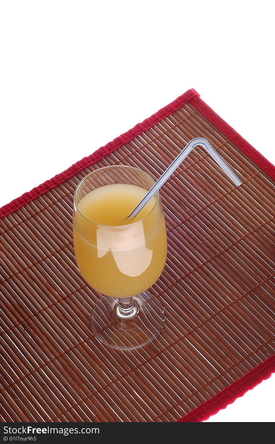 Pineapple's juice  in glass on bamboo mat