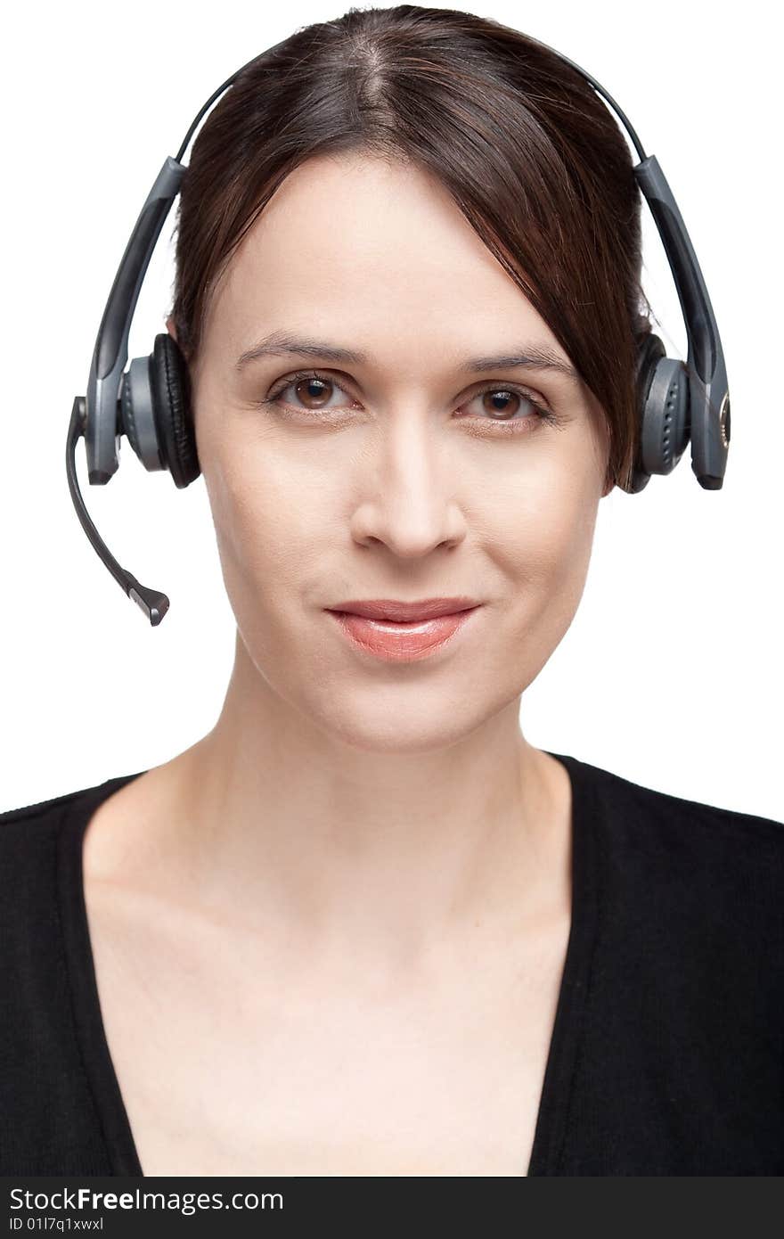 A woman with a headset communications gear on white. A woman with a headset communications gear on white.