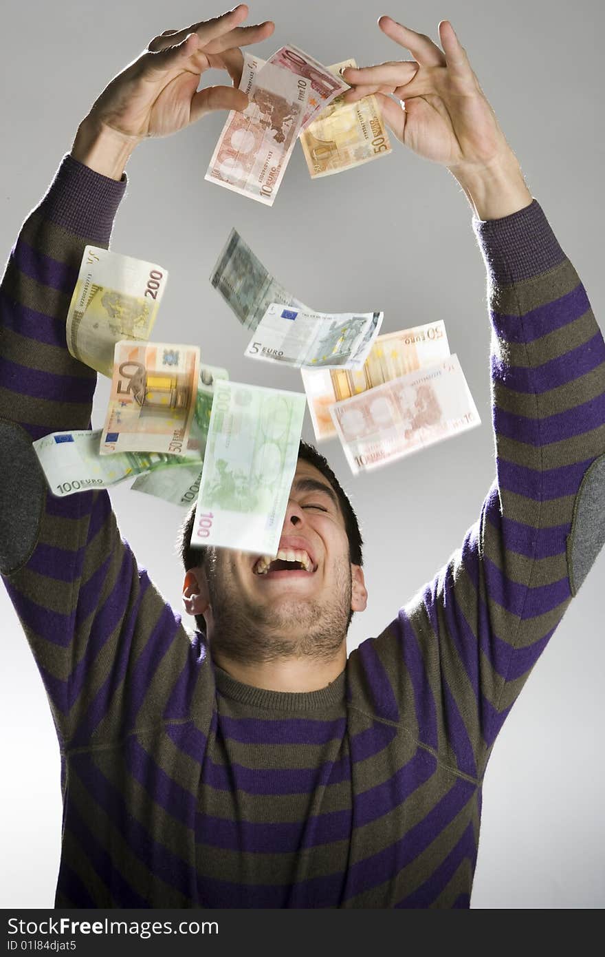 Happy businessman with bundle of euro money, good business!