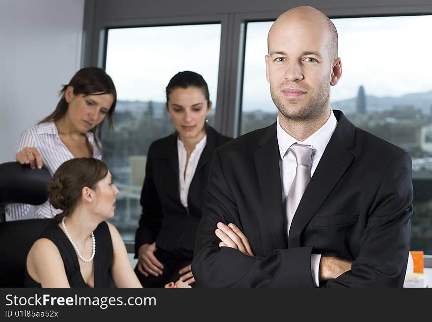 Young businessteam of four persons in office