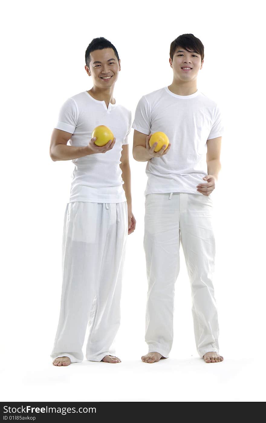 Asian young man holding grapefruit. Asian young man holding grapefruit