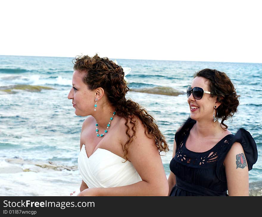 Sisters at beach wedding